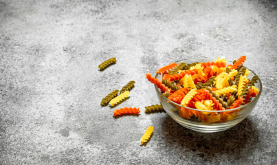 Colorful pasta in bowl.