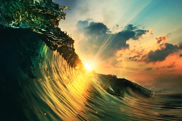 Gordijnen rough colored ocean wave falling down at sunset time © willyam
