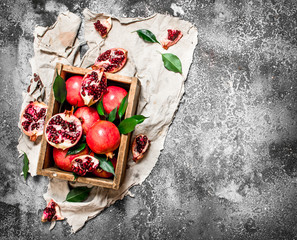 Ripe pomegranates in a box.