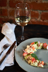 Salad with salmon and radish in the form of a month on a plate jpg