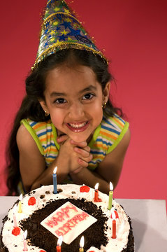 A girl with her birthday cake 