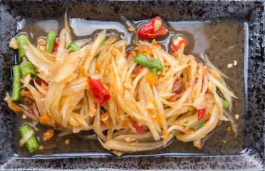 papaya salad (som tum thai) on plate