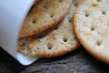 cracker in the paper wrapped on the wooden background,decoration food
