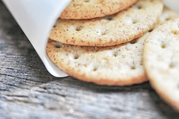 cracker in the paper wrapped on the wooden background,decoration food