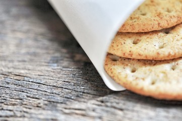 cracker in the paper wrapped on the wooden background,decoration food
