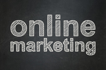 Advertising concept: Online Marketing on chalkboard background