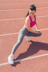 Sport girl workout. Exercise. Fitness. Health. Young  girl at stadium do some training.