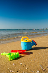 Fototapeta na wymiar Children's beach toys with sea