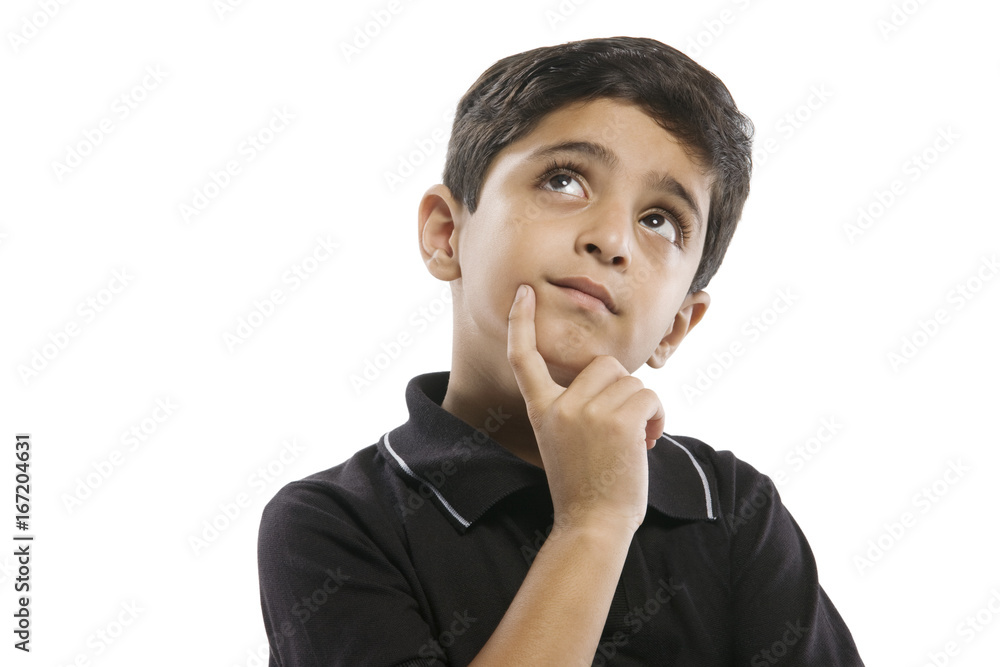 Wall mural Young boy thinking 