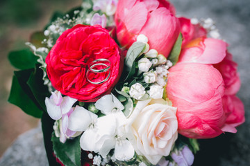 wedding rings and bouquet