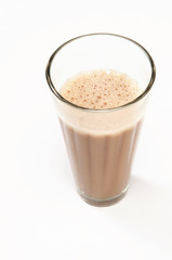 Close-up of traditional Indian milk tea isolated over white background 