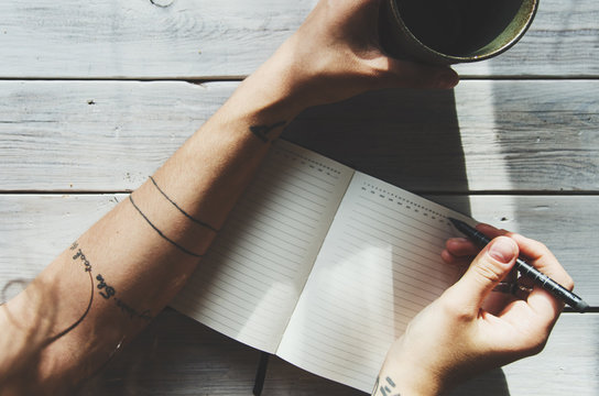 woman writing in a notebok