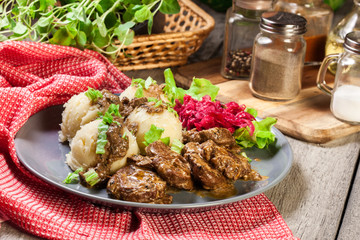 Pork tenderloin in mushroom sauce with boiled potatoes and salad..Pork tenderloin in mushroom sauce with boiled potatoes and salad..Pork tenderloin in mushroom sauce..
