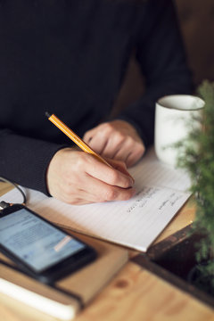 Woman writing, close-up