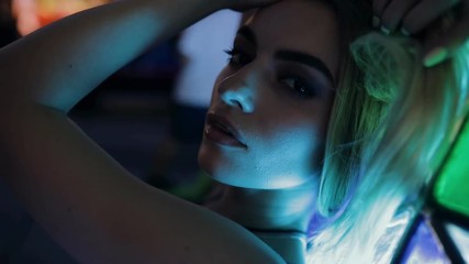 Beautiful sexy woman in blue light outdoor in night city, slow motion