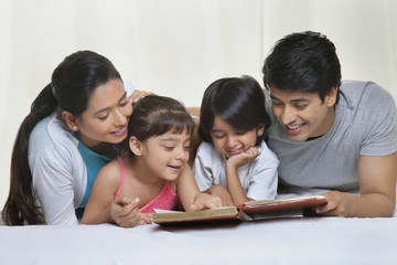 Family reading a book