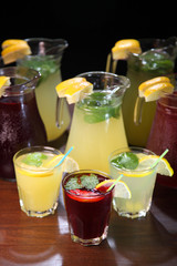 Fototapeta na wymiar Quenching thirst and refreshing drinks. Cold lemonades. Lemonade. Morse. Compote.