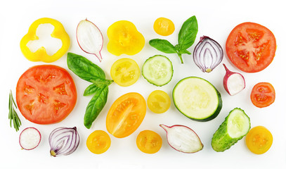 Multicolored colorful set of slices of vegetables yellow red and green isolated on white background top view, design for vegetable menu. Tomato, onion, cucumber, sweet pepper, zucchini, radish, basil.