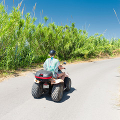Woman on atv on the road