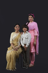 Portrait of Indian three generation family dressed in retro style