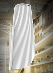 Blank white convex feather flag outdoor advertising shield flag banner or vertical wind banner mock up template isolated in mall.