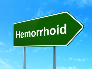 Medicine concept: Hemorrhoid on road sign background