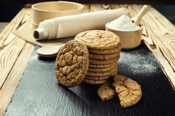 Biscuit sweet cookie background. Domestic stacked butter biscuit pattern concept,close up macro.Homemade cookies on wooden table.Cereal biscuits with the sesame,peanuts,sunflower and amaranth.