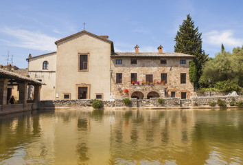 Terme Bagno Vignoni,  old thermal baths in the medieval village Bagno Vignoni, Tuscany, Italy - spa basin in the antique italian town