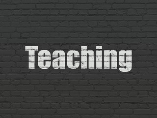 Obraz premium Studying concept: Teaching on wall background