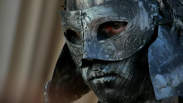 Ancient warrior or Gladiator posing over a dark background