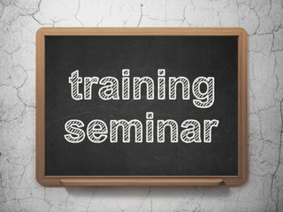 Education concept: Training Seminar on chalkboard background