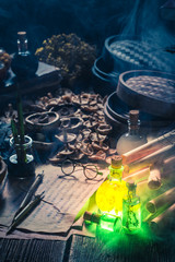 Old scrolls and recipe in magical alchemist laboratory