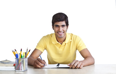 Portrait of a young man studying