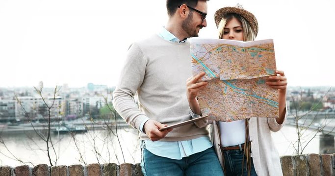 Beautiful couple sightseeing and traveling together - tourism concept