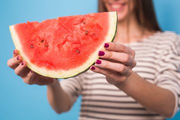 Summer, vacation, diet and vegans concept - Close up of woman holding watermelon