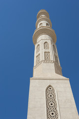 Fototapeta na wymiar Large minaret of a muslim mosque