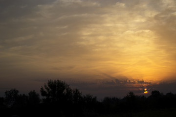 Fototapeta na wymiar Beautiful sky with amazing clouds at sunrise.