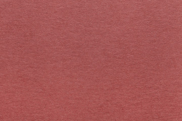 Fototapeta premium Texture of old dark red paper background, closeup. Structure of dense brown kraft cardboard