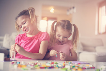 Fototapeta premium Girls playing at home.