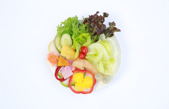 Vegetable salad on white background, Healthy food. Top view.