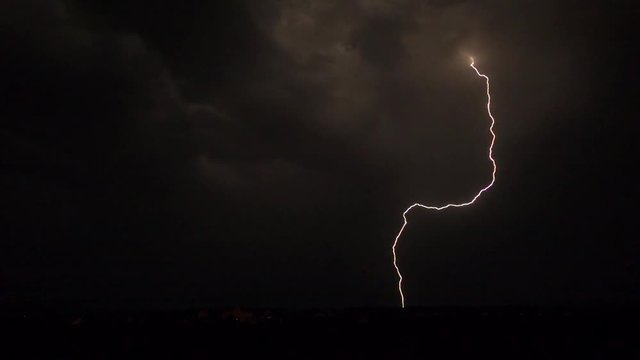 Super slow motion shot of a heavy lightning strike at night