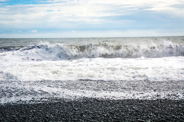 Black sand beach, Reynisfjara shore near the village Vik, atlantic ocean, Iceland