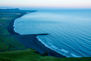 Black sand beach, Reynisfjara shore near the village Vik, atlantic ocean, Iceland