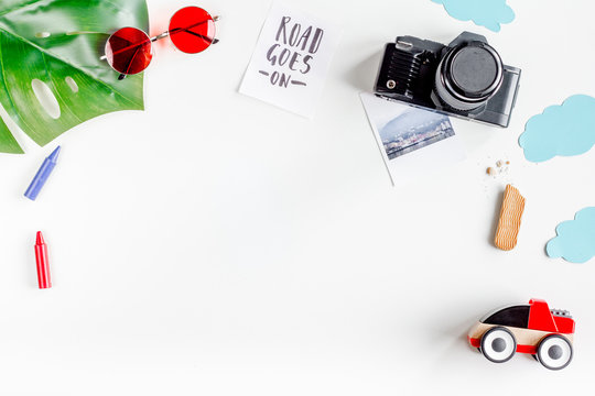 children tourism outfit with toys and camera on white background flat lay mockup