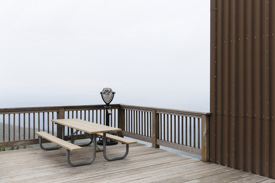 USA, Cannon Mountain, New Hampshire. A Binoculars Machine and picknick table on Cannon Mountain in the White Mountains, Franconia Notch State Park.