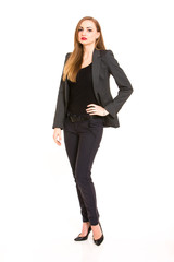 Dark blonde woman wearing smart casual outfit with hand on the hip on white background