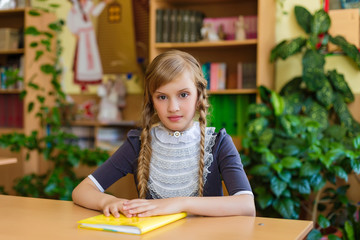 Girl at school desks