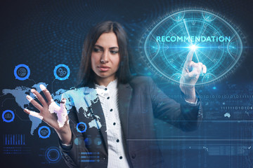 The concept of business, technology, the Internet and the network. A young entrepreneur working on a virtual screen of the future and sees the inscription: Recommendation