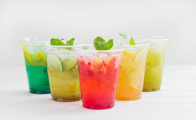 Summer lemonade group berry lemon ice cold white background.