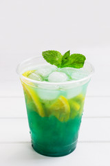 Lemonade citrus mint nonalcoholic white wooden background